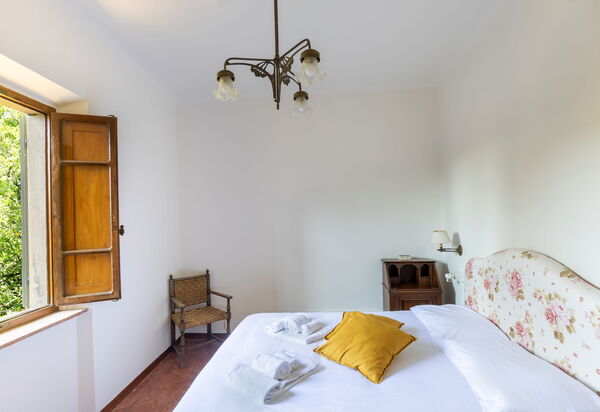 Podere Lupinati: chambre à coucher