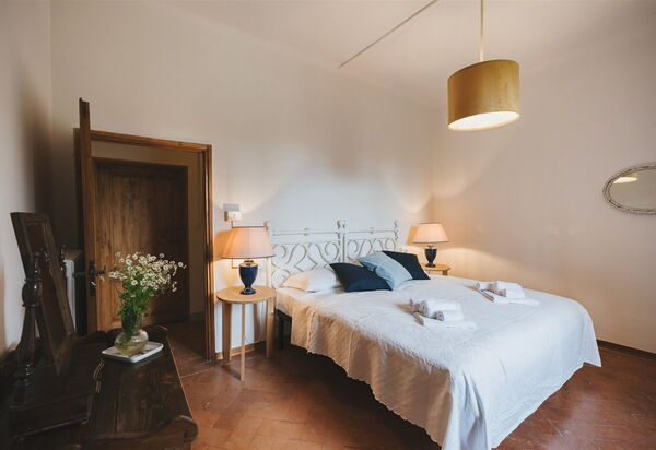 Podere Lupinati: chambre à coucher