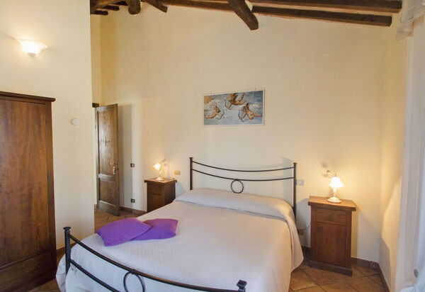 Podere Peteglia: chambre à coucher